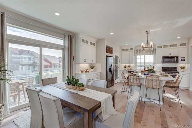 1193 Highview Dr, Erie, CO 80516 - dining space with a chandelier, light wood-type flooring, and recessed lighting