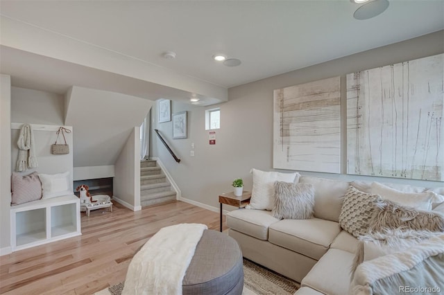 1193 Highview Dr, Erie, CO 80516 - living area with stairs, light wood-style flooring, baseboards, and recessed lighting