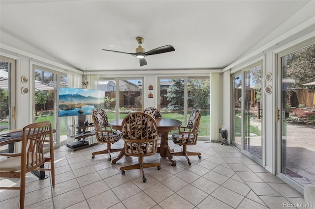 1164 W 101st Pl, Northglenn, CO 80260 - sunroom with tile patterned flooring, vaulted ceiling, and plenty of natural light