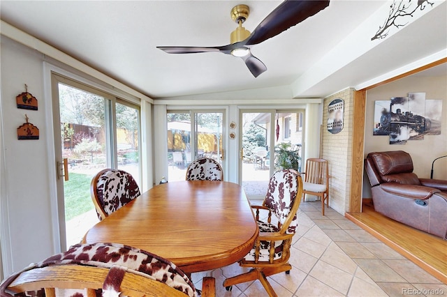 1164 W 101st Pl, Northglenn, CO 80260 - dining space with light tile patterned floors, a ceiling fan, and vaulted ceiling