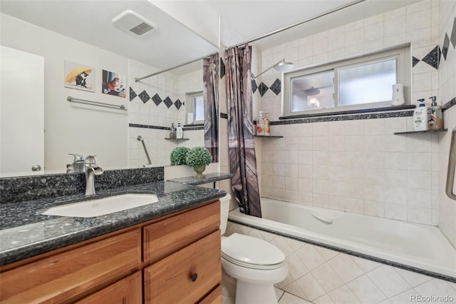 1164 W 101st Pl, Northglenn, CO 80260 - full bath featuring tiled shower / bath combo, vanity, and toilet