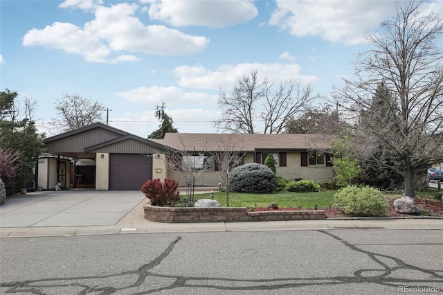 1164 W 101st Pl, Northglenn, CO 80260 - single story home with brick siding, a garage, concrete driveway, and a front yard