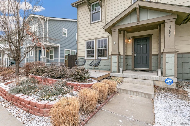 view of snow covered property entrance