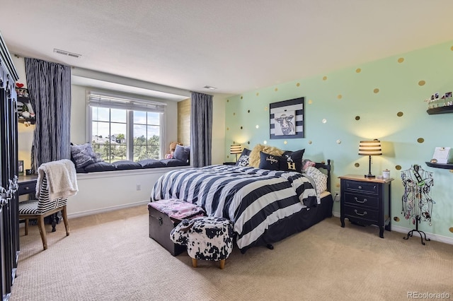 bedroom featuring carpet floors and baseboards