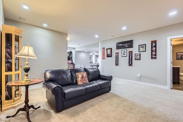 living room featuring light carpet, recessed lighting, and baseboards