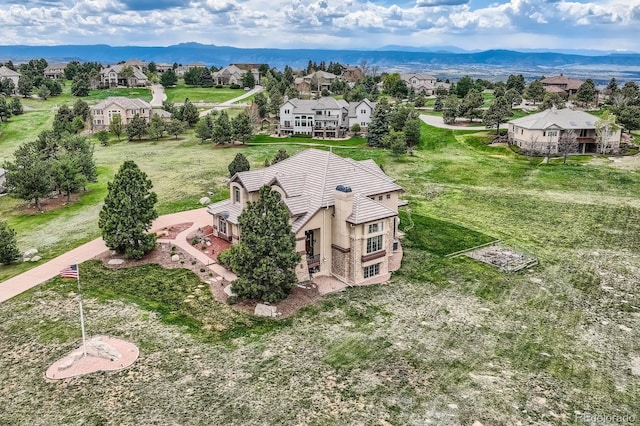 aerial perspective of suburban area featuring a mountainous background