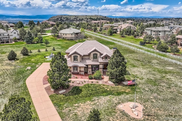 aerial perspective of suburban area featuring a mountainous background