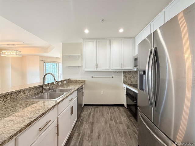 925 N Lincoln St Unit 8H, Denver, CO 80203 - kitchen with appliances with stainless steel finishes, white cabinets, recessed lighting, and open shelves