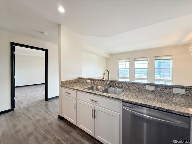 925 N Lincoln St Unit 8H, Denver, CO 80203 - kitchen with dishwasher, light stone counters, wood finished floors, and white cabinets