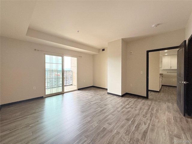 925 N Lincoln St Unit 8H, Denver, CO 80203 - empty room with light wood-type flooring and a smoke detector