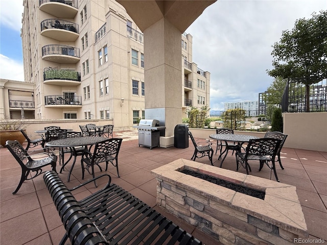 925 N Lincoln St Unit 8H, Denver, CO 80203 - view of patio featuring grilling area, outdoor dining space, and a fire pit