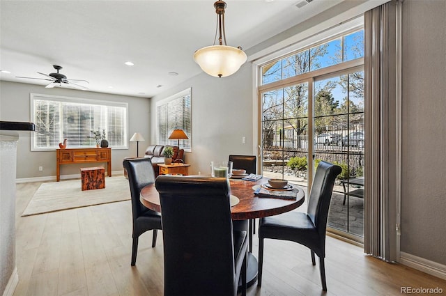 dining room with baseboards, recessed lighting, ceiling fan, and light wood-type flooring