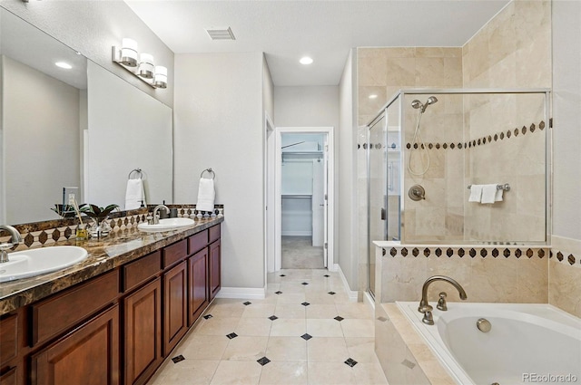 full bath featuring visible vents, a shower stall, and a sink