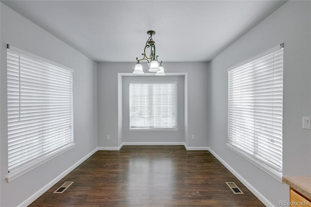 3355 Willowrun Dr, Castle Rock, CO 80109 - spare room with a chandelier and dark wood-style floors