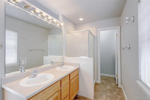 3355 Willowrun Dr, Castle Rock, CO 80109 - full bath featuring double vanity, a stall shower, recessed lighting, and tile patterned floors