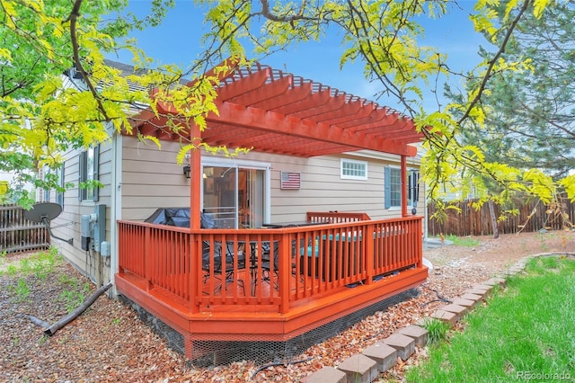 wooden terrace with fence and a pergola