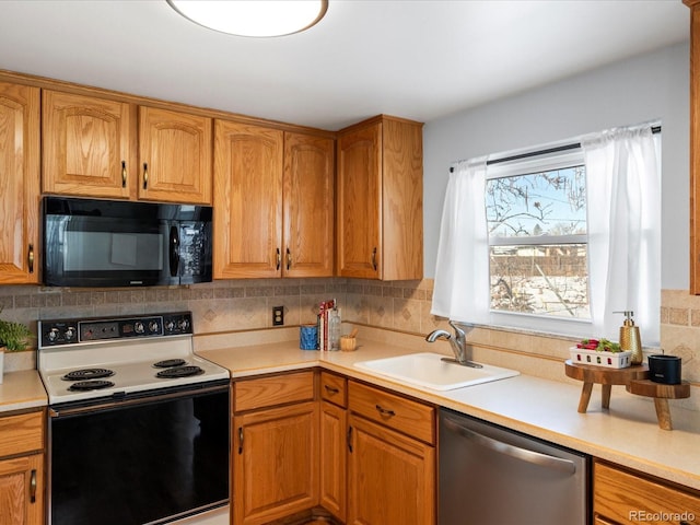 kitchen featuring range with electric cooktop, dishwasher, sink, and tasteful backsplash