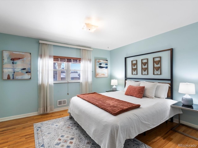 bedroom with light hardwood / wood-style floors