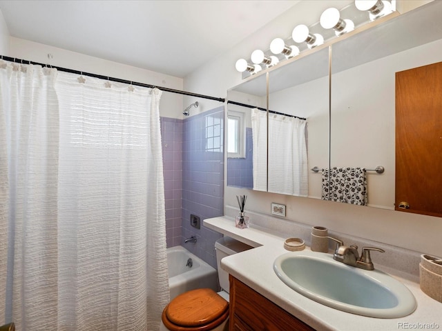 full bathroom featuring vanity, shower / bath combination with curtain, and toilet