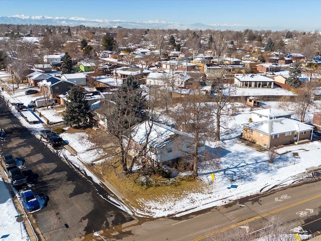 snowy aerial view with a mountain view