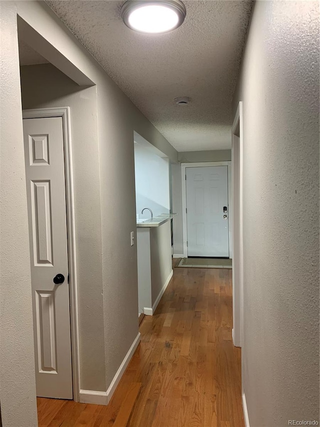 hallway featuring light hardwood / wood-style flooring