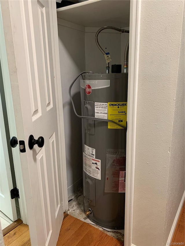 utility room featuring water heater