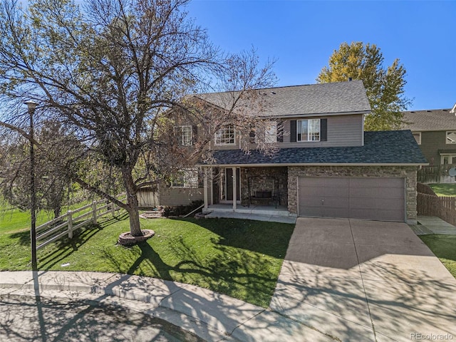 view of front of home featuring a garage, a porch, and a front lawn