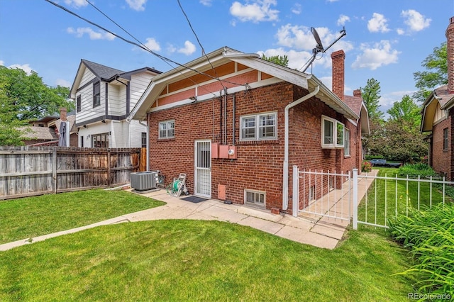 869 S Williams St, Denver, CO 80209 - back of house with a chimney, brick siding, central AC unit, and a patio