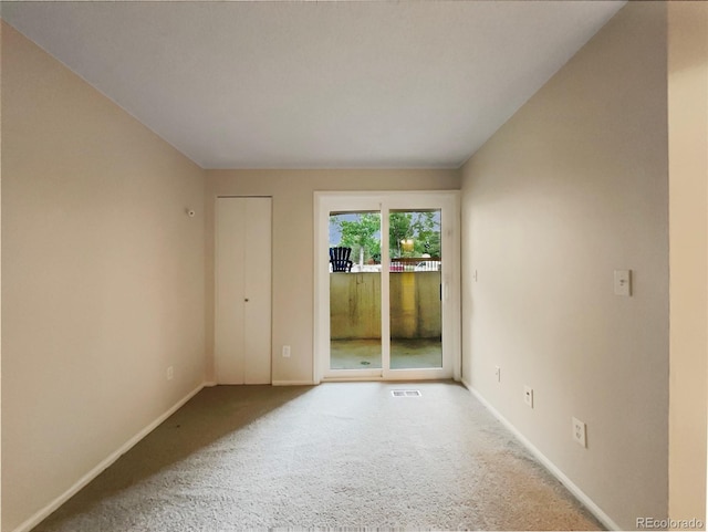 view of carpeted spare room