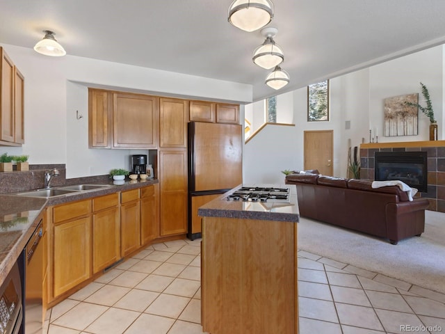0251 Fawn Ct, Silverthorne, CO 80498 - kitchen featuring fridge, light tile patterned floors, a kitchen island, dishwasher, and dark countertops