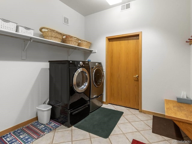 0251 Fawn Ct, Silverthorne, CO 80498 - laundry area with washer and clothes dryer and light tile patterned floors
