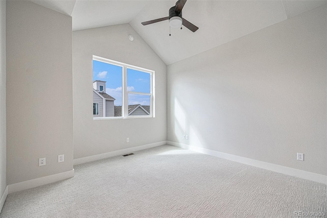 empty room with carpet, lofted ceiling, and ceiling fan