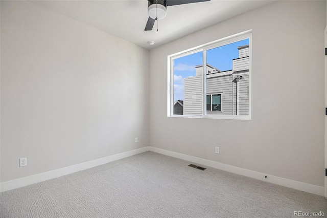 unfurnished room with ceiling fan and carpet floors