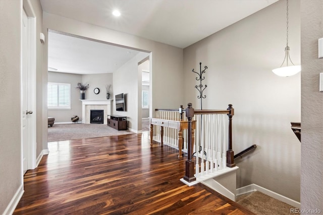 hallway with dark hardwood / wood-style floors