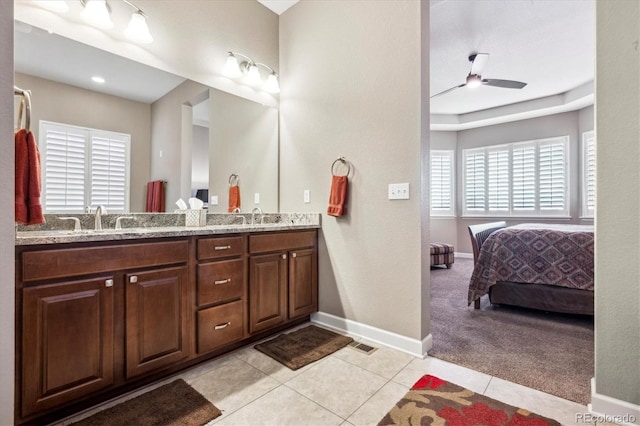 bathroom featuring ceiling fan, tile patterned flooring, and vanity