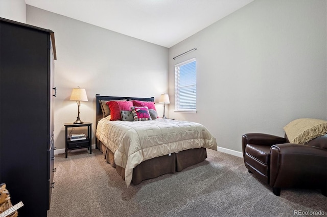 bedroom featuring carpet floors and vaulted ceiling