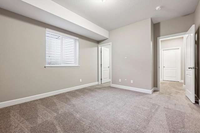 unfurnished bedroom with light carpet