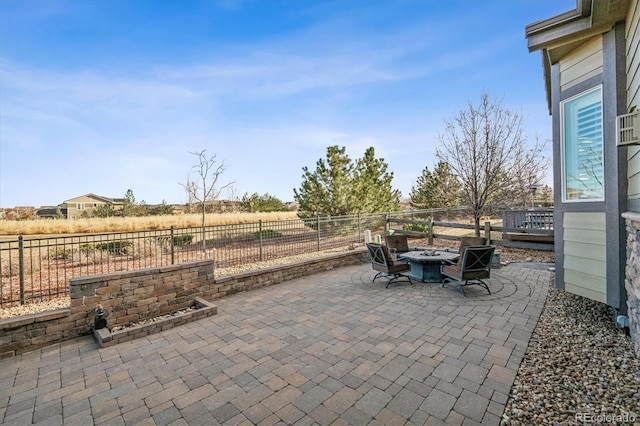 view of patio with an outdoor fire pit