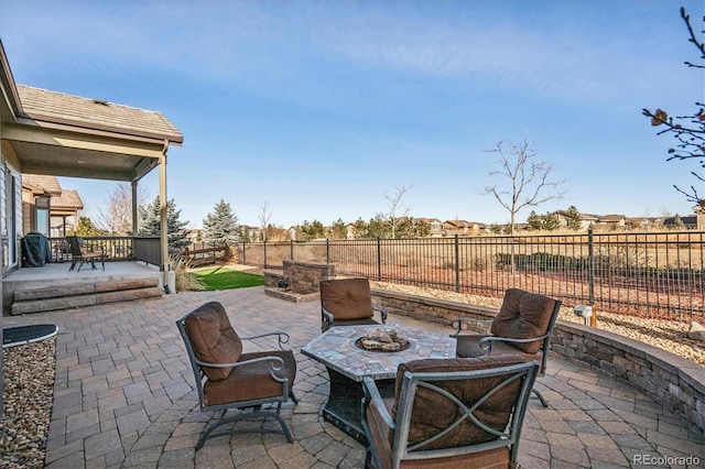 view of patio with a fire pit