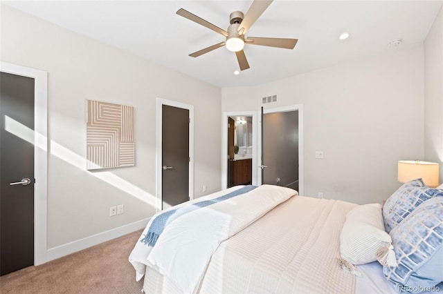 bedroom featuring carpet flooring, baseboards, a ceiling fan, recessed lighting, and connected bathroom