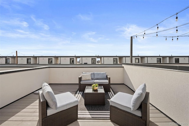 wooden terrace featuring an outdoor living space