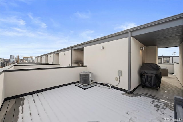 wooden terrace featuring cooling unit
