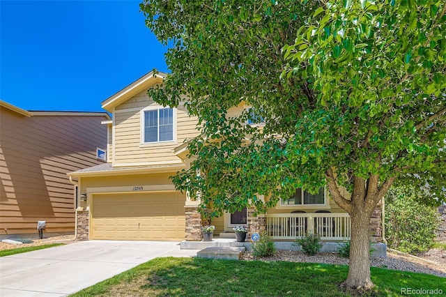 12763 E 105th Pl, Commerce City, CO 80022 - view of front of house featuring a porch, driveway, an attached garage, and stone siding