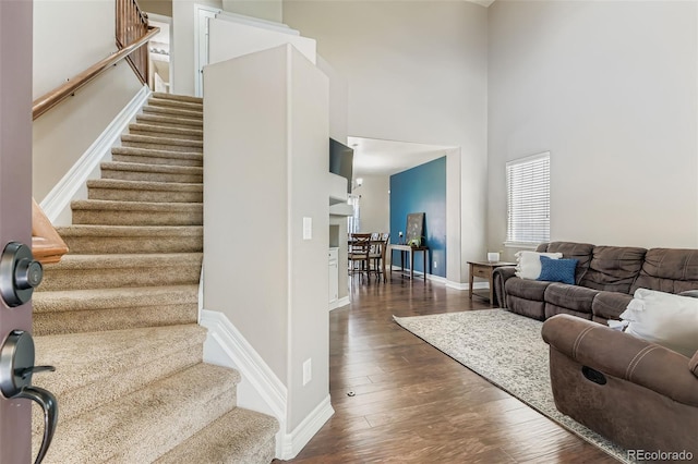 12763 E 105th Pl, Commerce City, CO 80022 - stairway with wood finished floors and a towering ceiling
