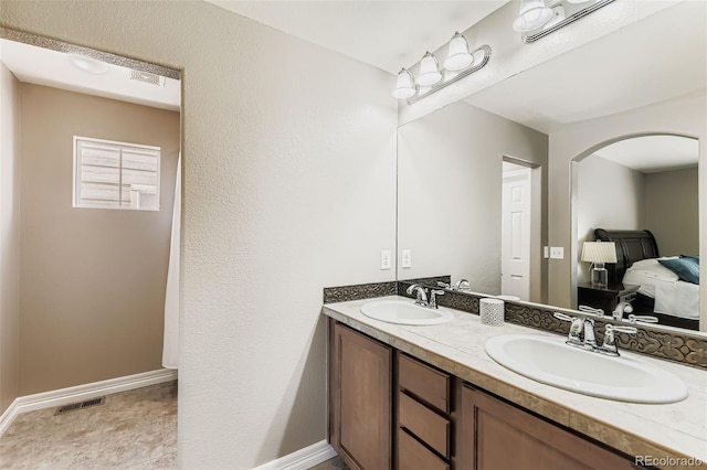 12763 E 105th Pl, Commerce City, CO 80022 - full bathroom featuring double vanity and baseboards