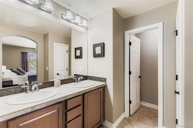 12763 E 105th Pl, Commerce City, CO 80022 - bathroom featuring double vanity and tile patterned flooring