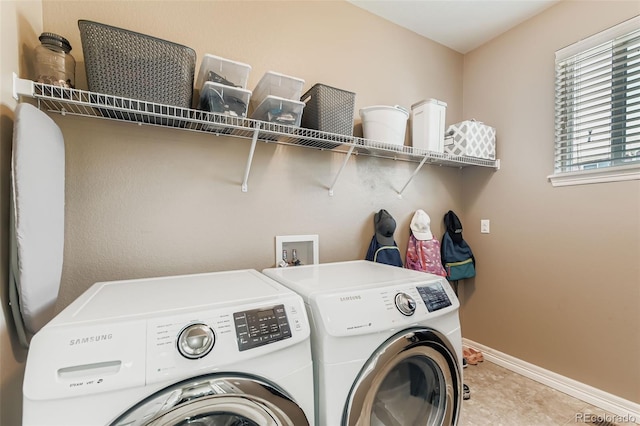 12763 E 105th Pl, Commerce City, CO 80022 - laundry area with separate washer and dryer and light tile patterned flooring