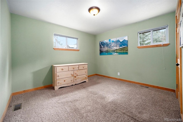 12569 S Parker Ave, Pine, CO 80470 - carpeted bedroom featuring baseboards and visible vents