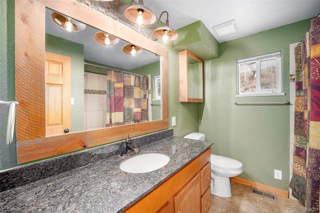 12569 S Parker Ave, Pine, CO 80470 - full bathroom featuring vanity, tile patterned flooring, toilet, and visible vents