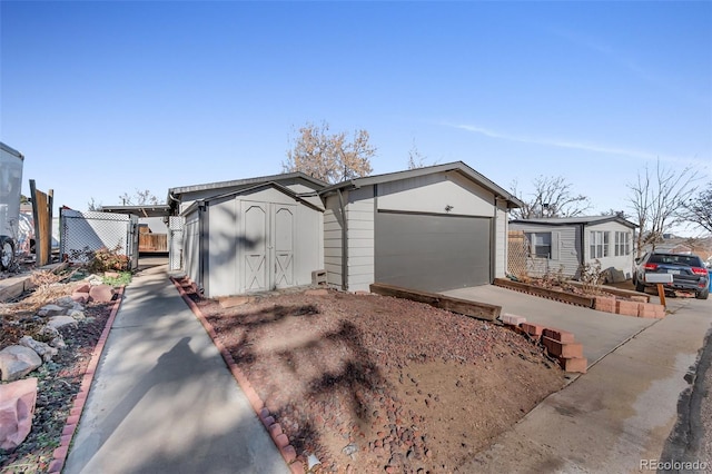 view of outbuilding featuring a carport and a garage